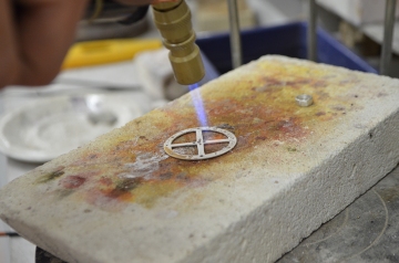 Heating the piece with a gas torch