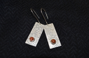 Earrings with textured background and set stones